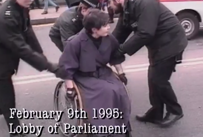 February 9th 1995 lobby of parlimant image - police grabbing someone in a wheelchair.