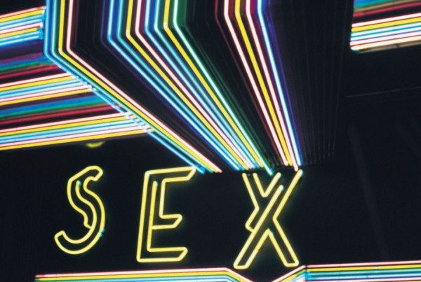 A neon sign that spells out the word Sex