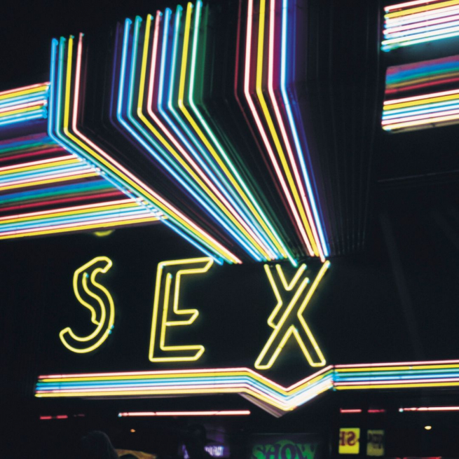 A neon sign that spells out the word Sex