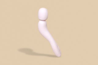 The white vibrator against a beige background