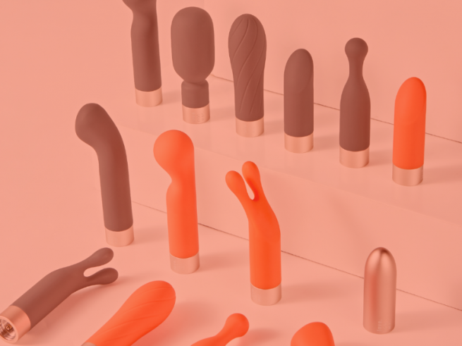 A selection of grey and orange vibrators in different shapes.