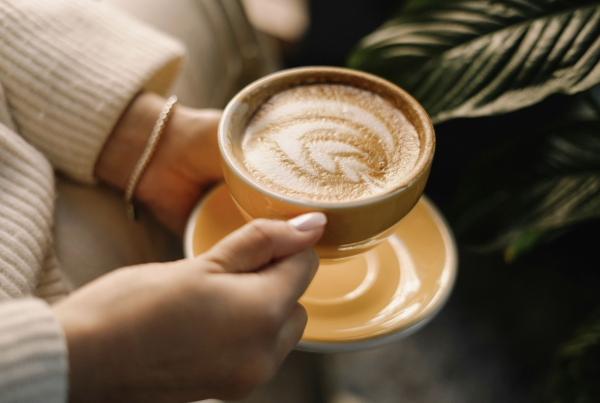 ADHD and loneliness: A person holding a cup of coffee in their hands