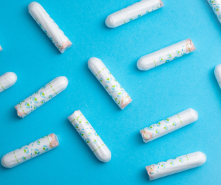 Periods: a few white tampons on a blue background