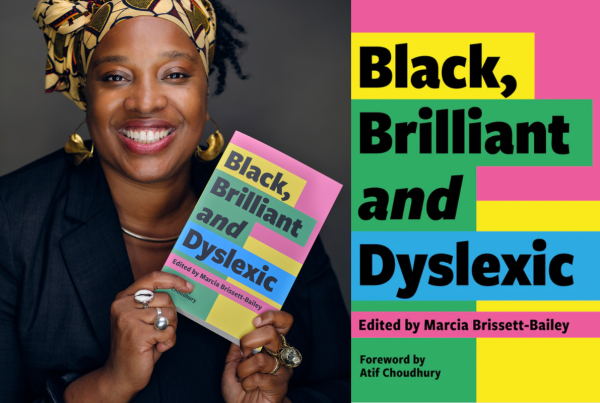 Marcia is a Black woman who is wearing gold and brown scarf onher head. She has a black blazer on with gold hoop earrings. She is smiling at the camera while holding a copy of her book, Black, Brilliant and Dyslexic